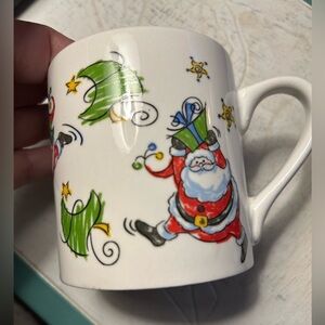 2 Vintage MSI dancing Santa mugs. No chips or cracks